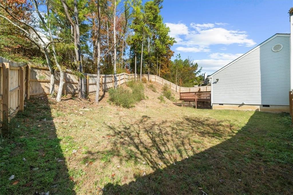 203 Bainbridge Way Dallas, GA 30132 - Photo 34 of 38 a view of a yard with large trees
