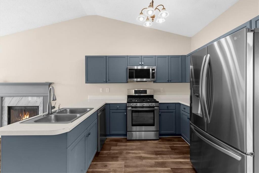 203 Bainbridge Way Dallas, GA 30132 - Photo 9 of 38 a kitchen with stainless steel appliances granite countertop a sink stove and refrigerator