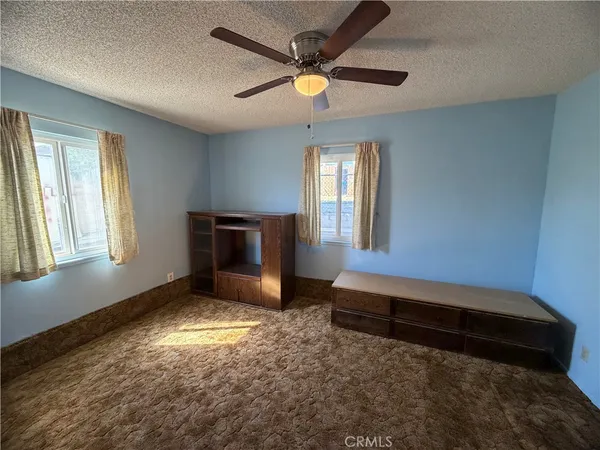 a view of livingroom with window and ceiling fan