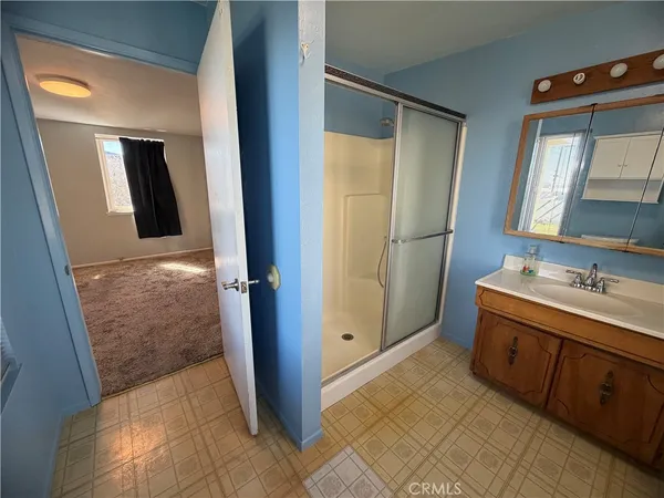 a bathroom with a double vanity sink and mirror