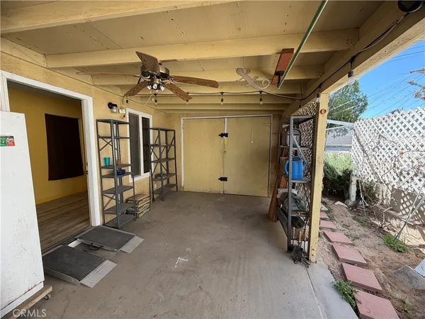 a view of a garage with wooden door