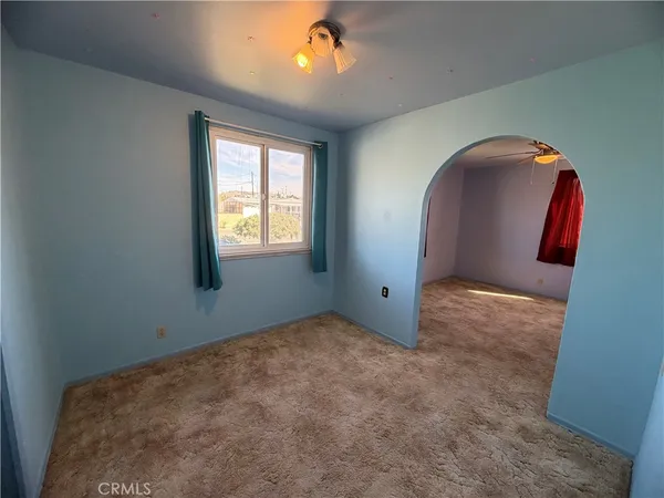 a view of an empty room and window