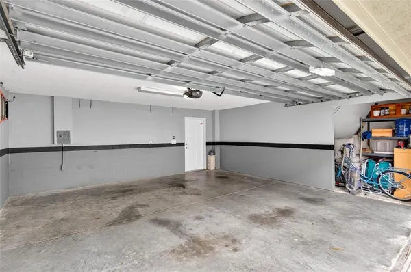 a view of a room with furniture and a window