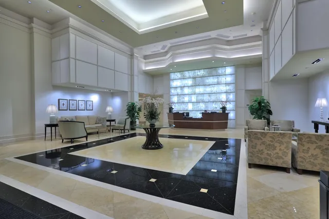 a living room with furniture and a lamp