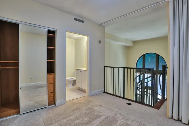 a view of a hallway with stairs