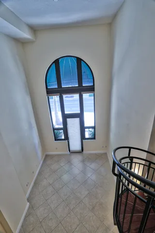 a view of entryway kitchen and hall way with furniture