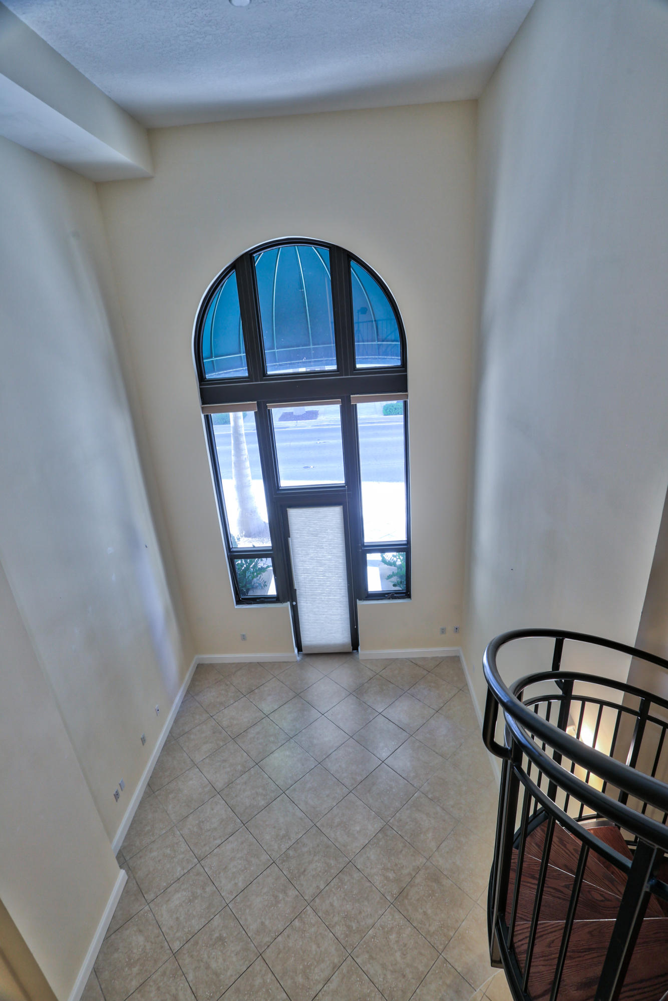 801 South Olive Avenue, Unit 120 West Palm Beach, FL 33401 - Photo 4 of 17 a view of an entryway door with a staircase