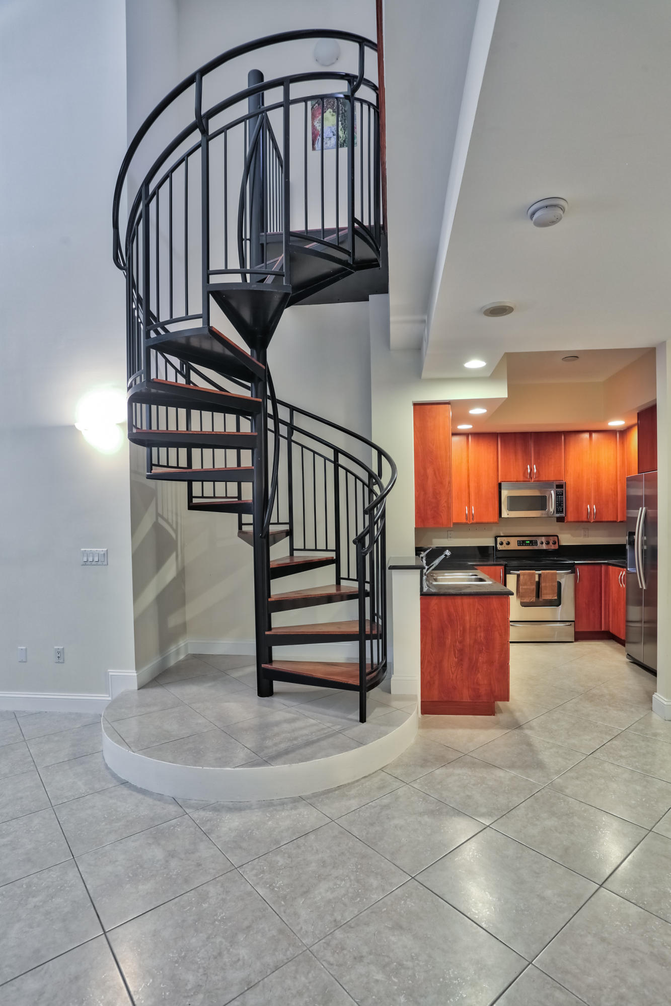801 South Olive Avenue, Unit 120 West Palm Beach, FL 33401 - Photo 5 of 17 a view of entryway kitchen and hall way with furniture