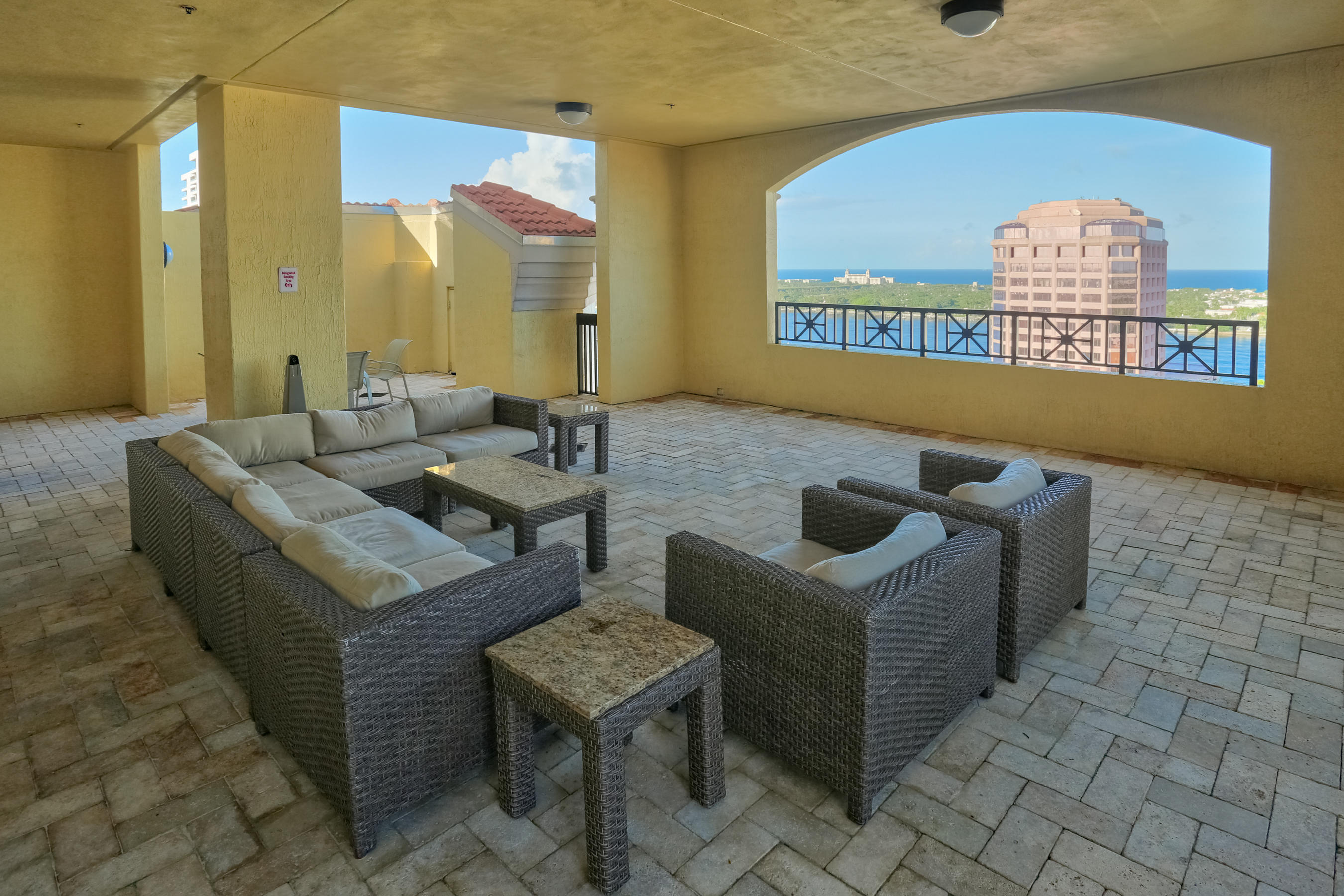 801 South Olive Avenue, Unit 120 West Palm Beach, FL 33401 - Photo 8 of 17 a living room with furniture and a rug