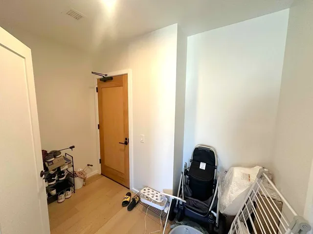 a room with a window and gym equipment