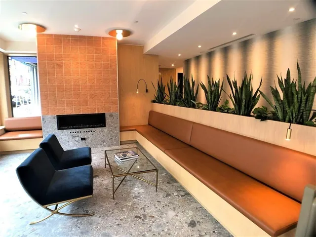 a room with pool table and windows