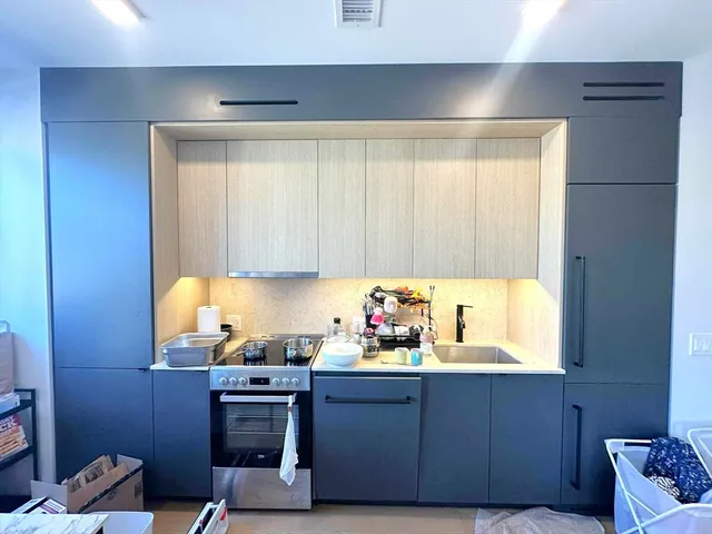 a kitchen with a cabinets and window