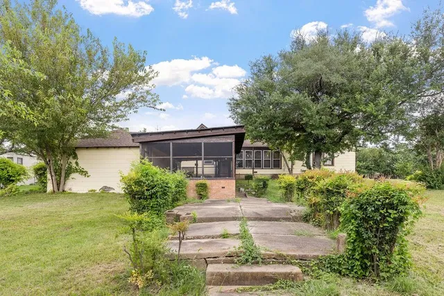 a view of a car parked in front of a house
