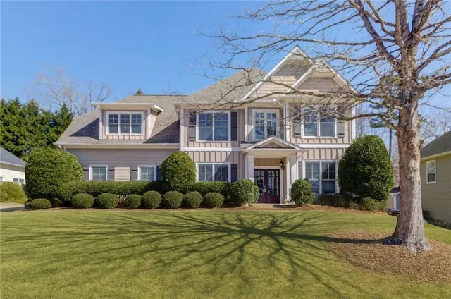 a front view of a house with a yard