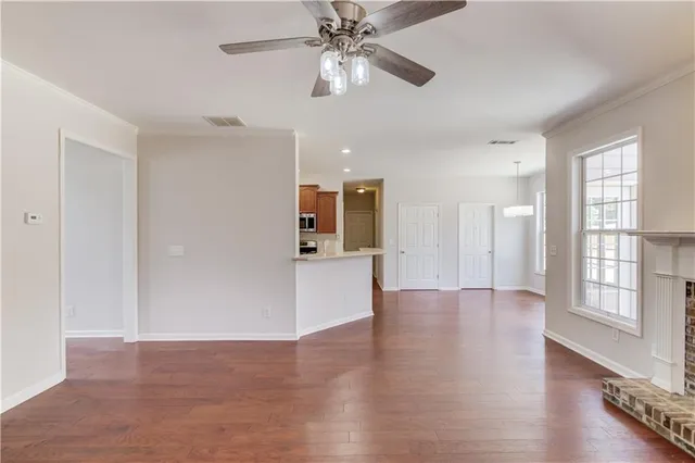 a view of room with window and ceiling fan