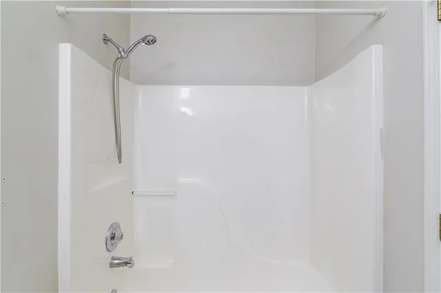 an empty room with a ceiling fan