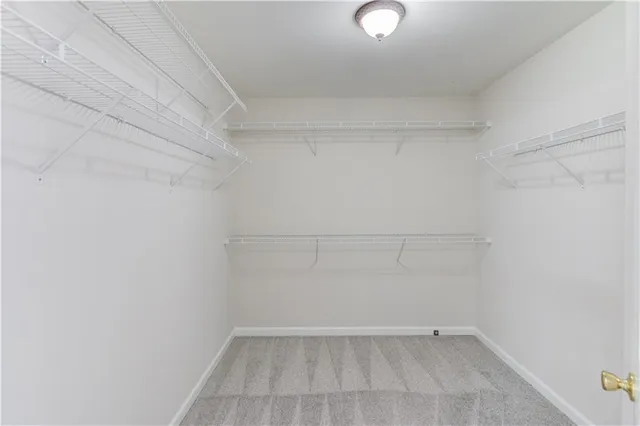 an aerial view of a house with garden space and swimming pool