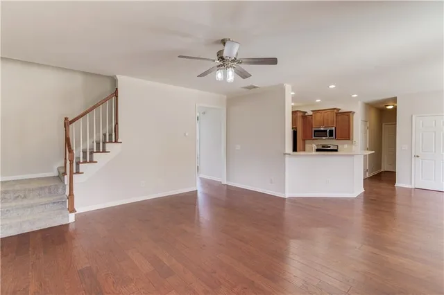 a kitchen with stainless steel appliances a sink stove and cabinets