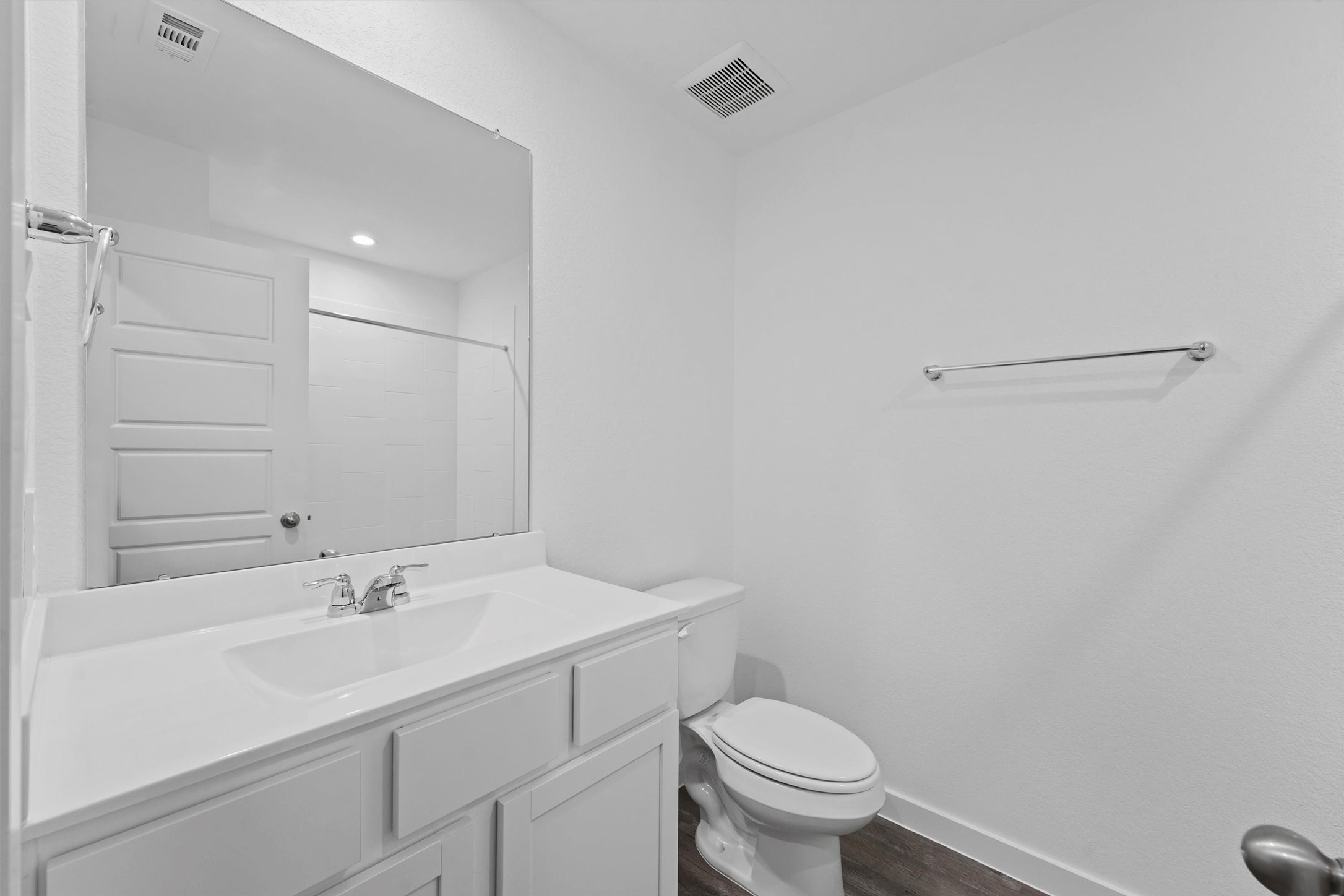 1115 Briscoe Court Rosharon, TX 77583 - Photo 3 of 16 a bathroom with a sink a toilet and a mirror