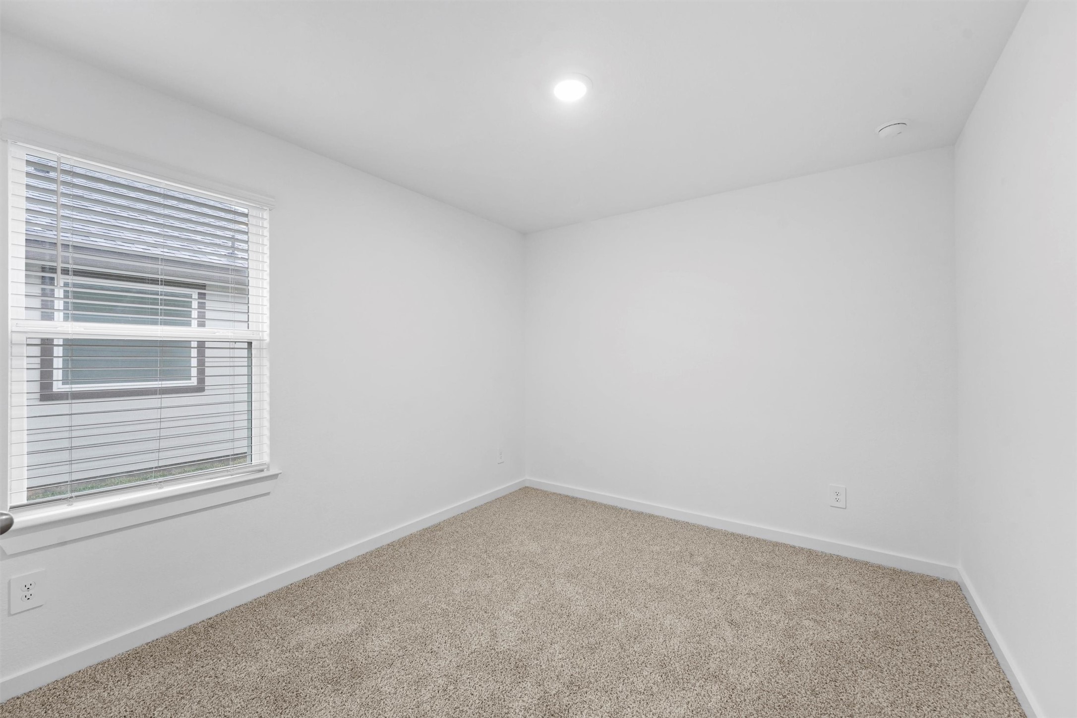 1115 Briscoe Court Rosharon, TX 77583 - Photo 4 of 16 an empty room with a window