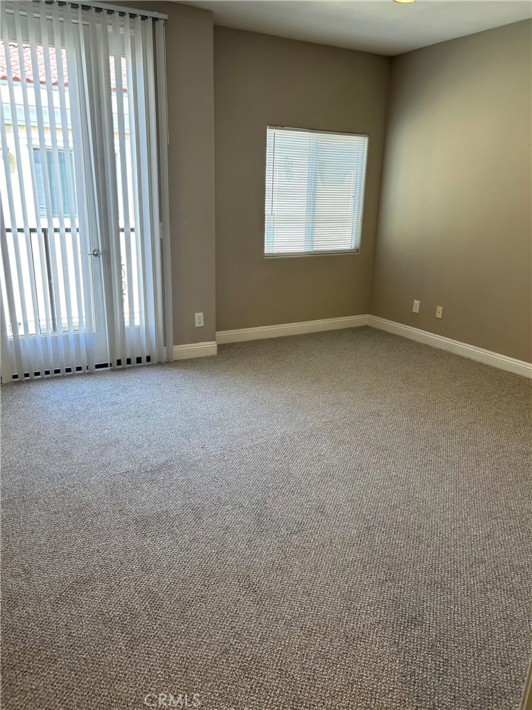 708 West Duarte Road, Unit C Monrovia, CA 91016 - Photo 6 of 12 an empty room with windows