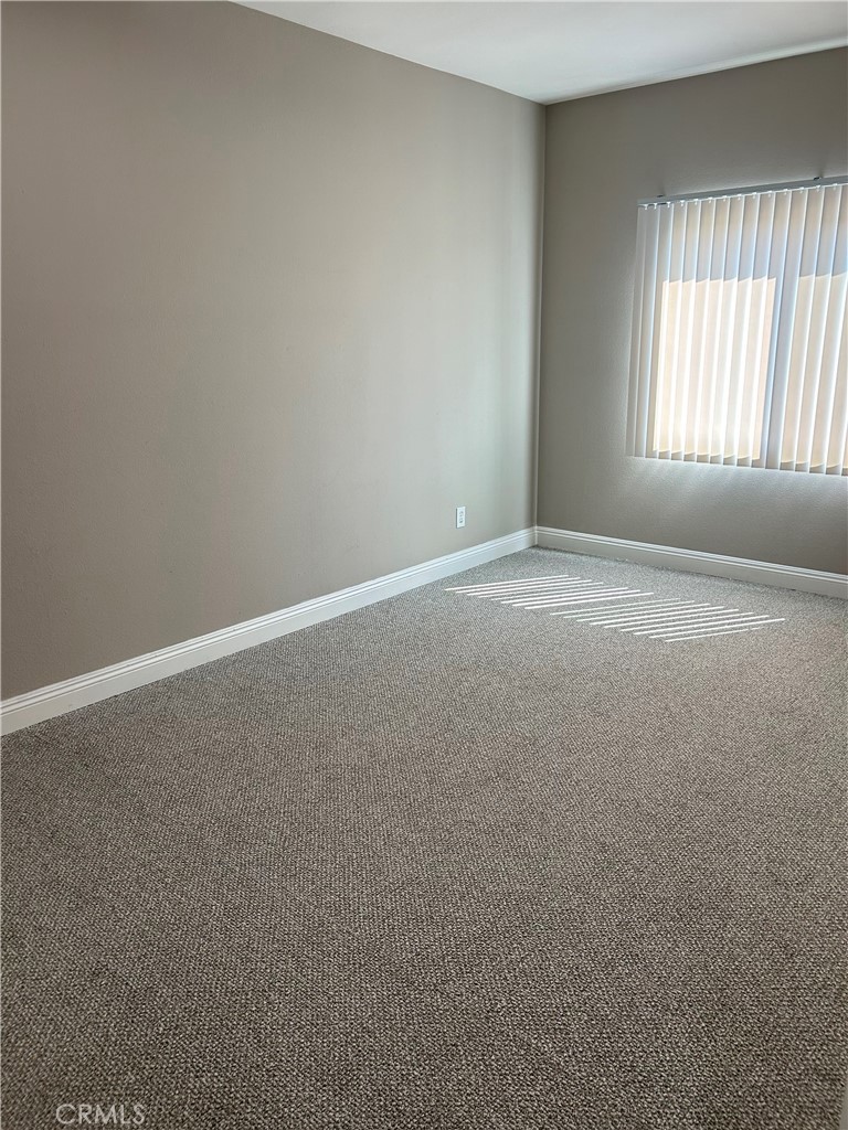 708 West Duarte Road, Unit C Monrovia, CA 91016 - Photo 8 of 12 an empty room with a window