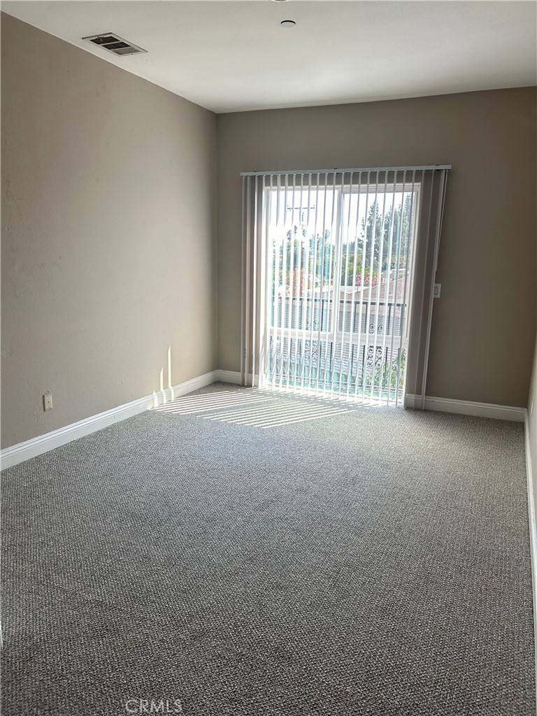 708 West Duarte Road, Unit C Monrovia, CA 91016 - Photo 10 of 12 a view of an empty room with a window