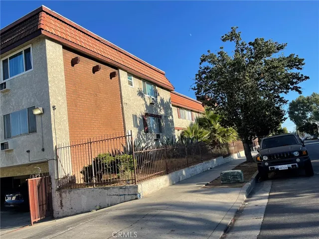 a view of a car park side of the road