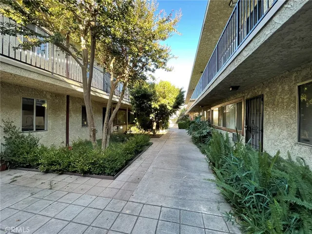 a view of a pathway with a house