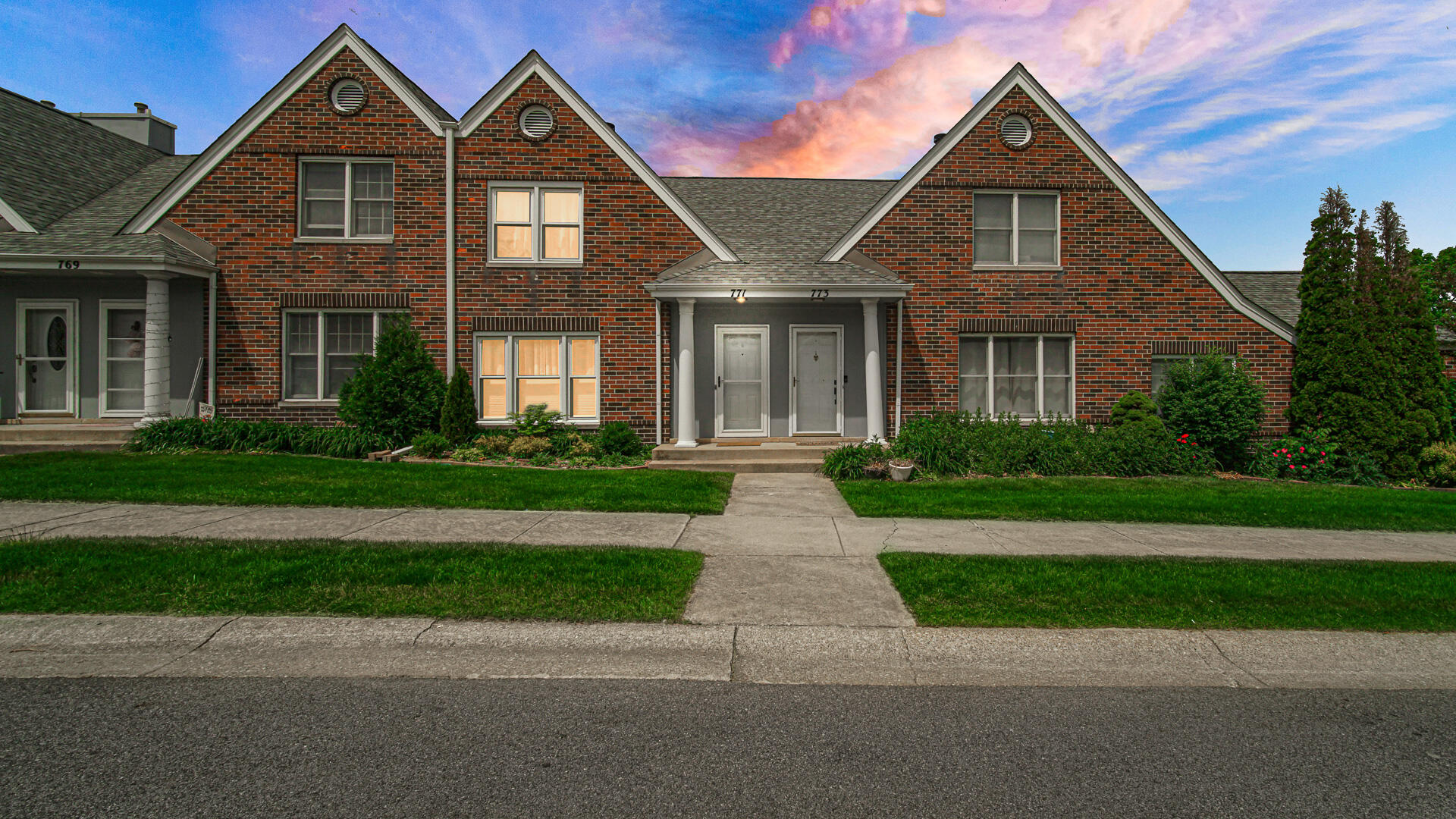 771 Kenmare Parkway Crown Point, IN 46307 - Photo 1 of 20 a front view of a house with a yard