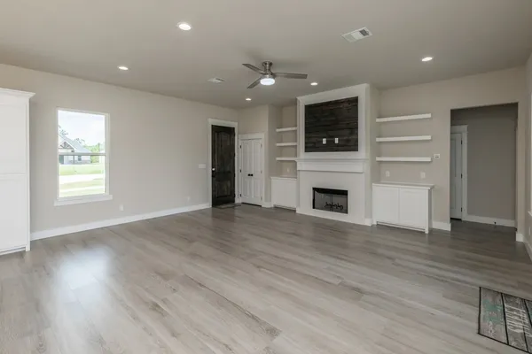 a kitchen with kitchen island a sink stainless steel appliances and cabinets