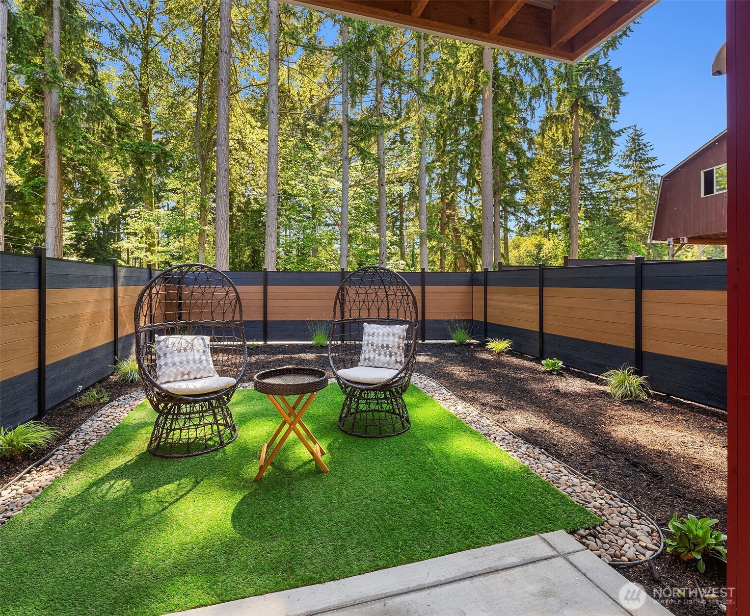 19722 Filbert Drive, Unit B3 Bothell, WA 98012 - Photo 7 of 39 a view of a patio with table and chairs potted plants and palm tree