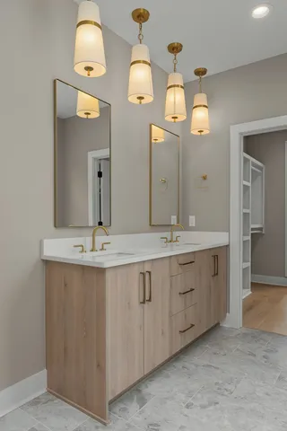 a bathroom with a double vanity sink and a mirror