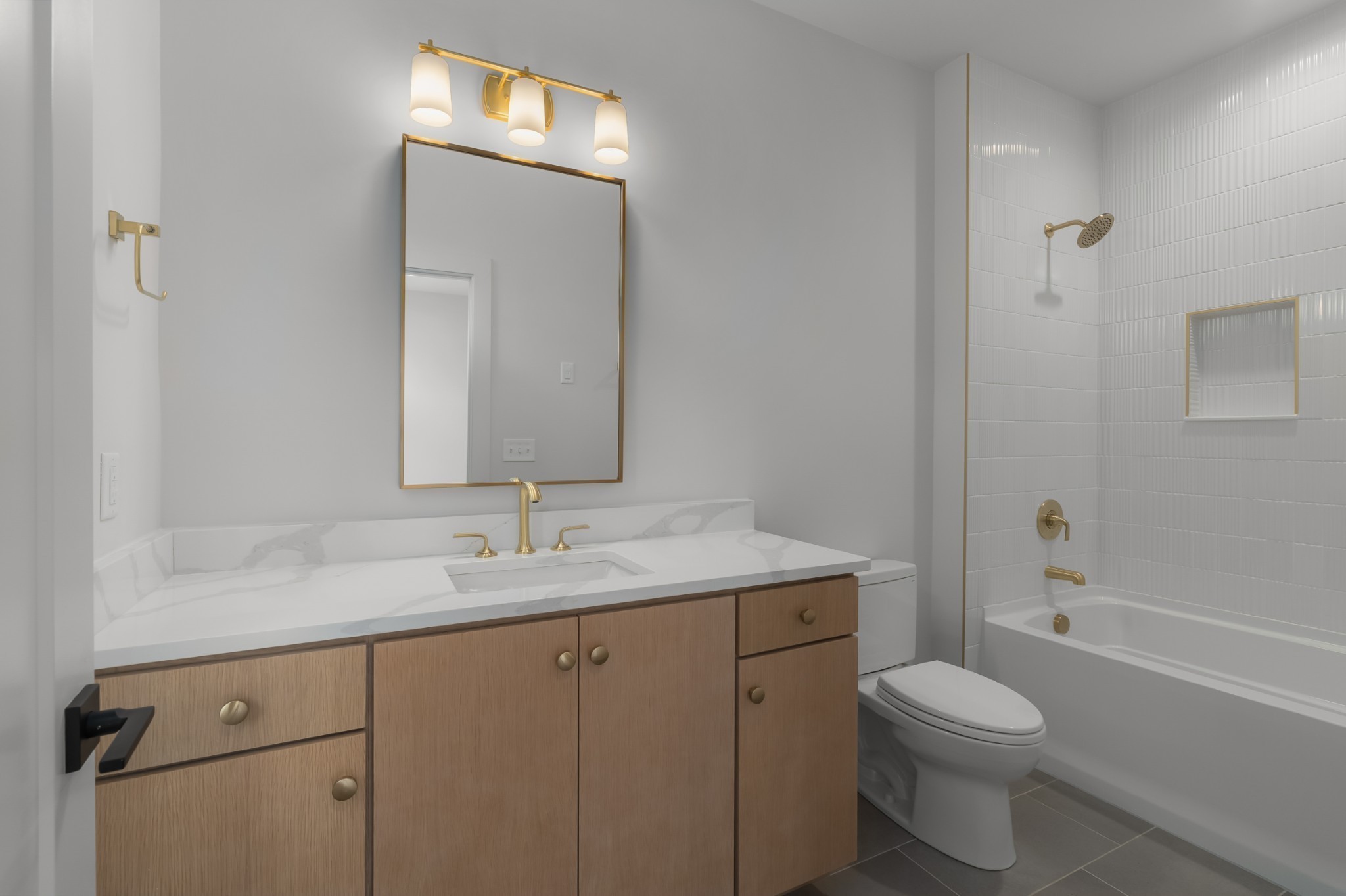 2305 Eastland Avenue, Unit K Nashville, TN 37206 - Photo 29 of 44 a bathroom with a granite countertop sink toilet and shower