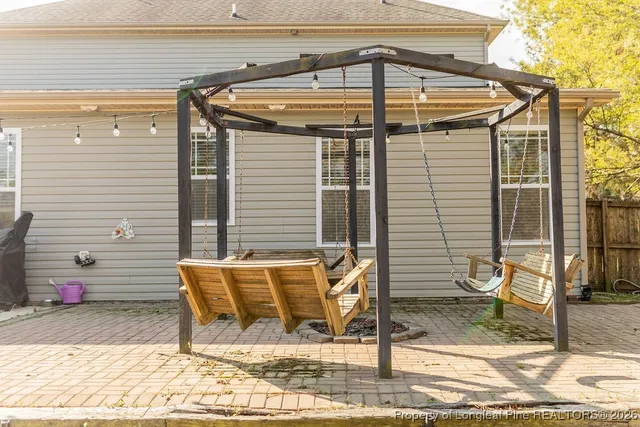a swimming pool that has trees in front of it