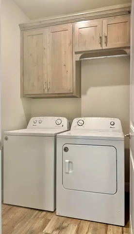a utility room with dryer and washer