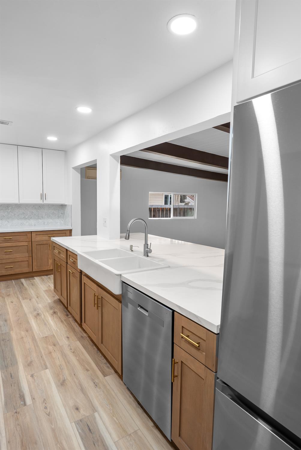 1125 Wellesley Avenue Modesto, CA 95350 - Photo 13 of 43 a kitchen with a sink and cabinets