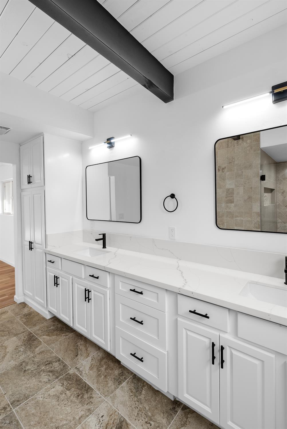 1125 Wellesley Avenue Modesto, CA 95350 - Photo 19 of 43 a bathroom with a double vanity sink and mirror