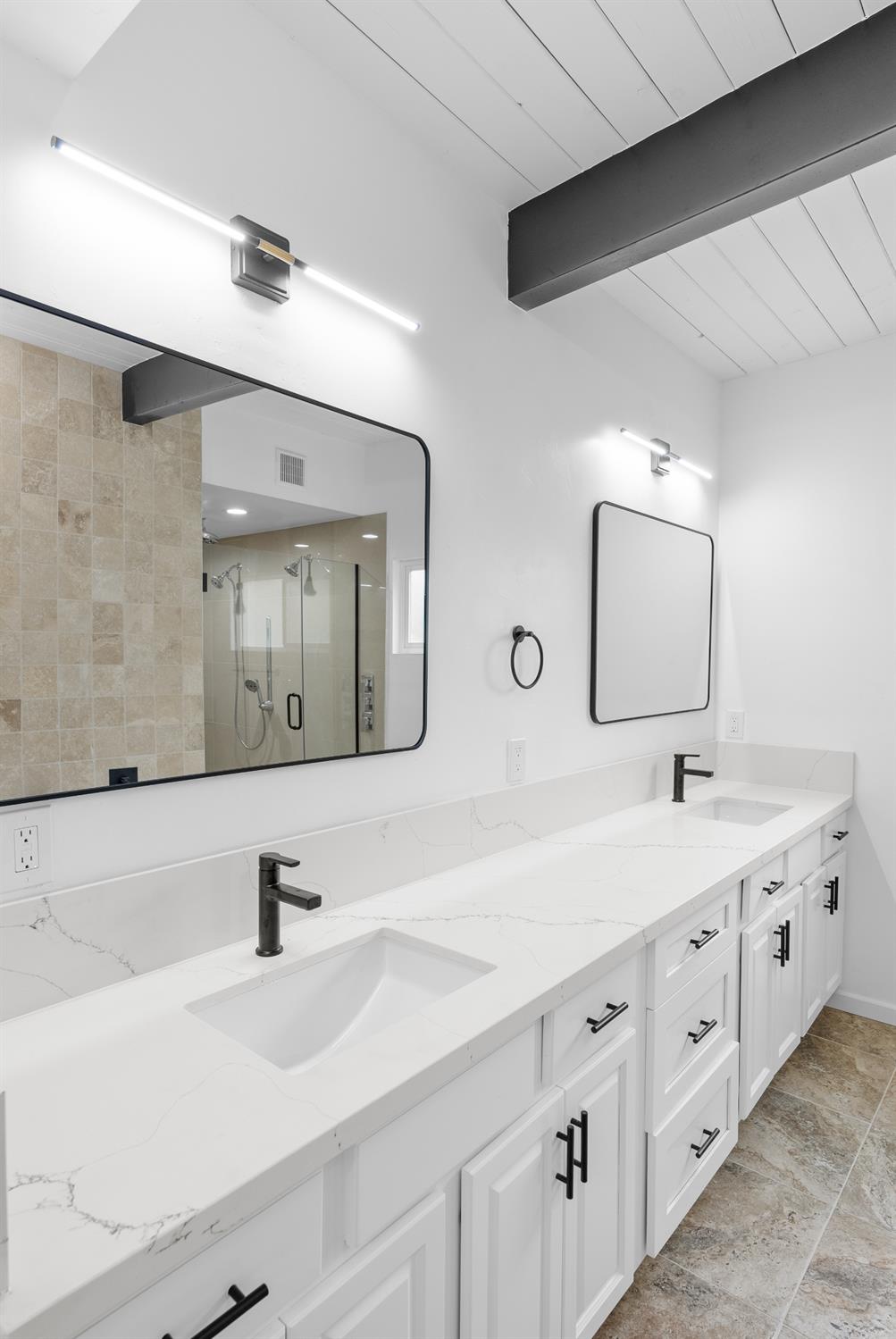 1125 Wellesley Avenue Modesto, CA 95350 - Photo 20 of 43 a bathroom with double sink and a mirror