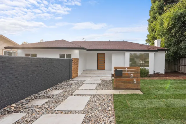 a house view with a garden space