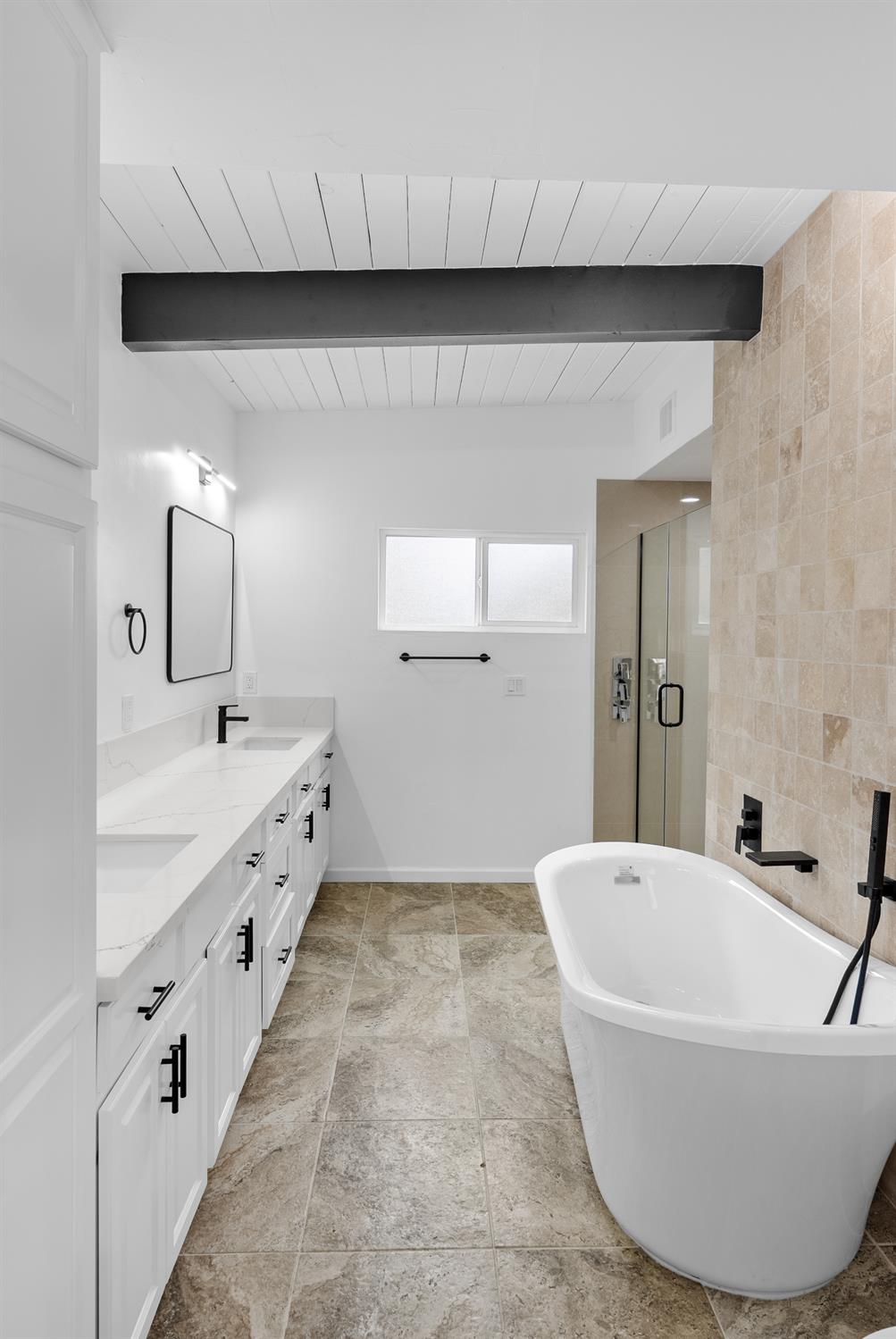 1125 Wellesley Avenue Modesto, CA 95350 - Photo 21 of 43 a bathroom with a tub sink and mirror