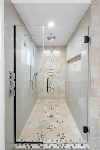a bathroom with a shower and a sink