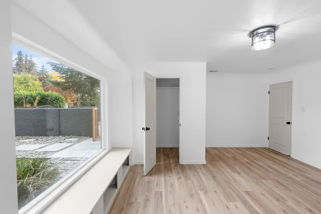 a view of hallway with wooden floor
