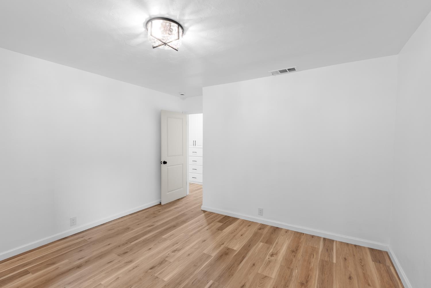 1125 Wellesley Avenue Modesto, CA 95350 - Photo 30 of 43 a view of empty room with wooden floor