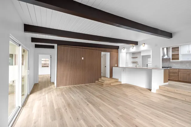 a large white bed in a white room