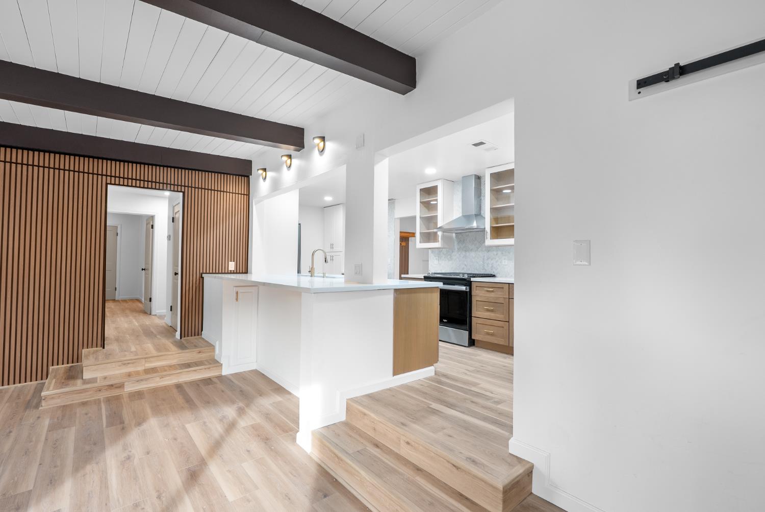1125 Wellesley Avenue Modesto, CA 95350 - Photo 9 of 43 a view of a kitchen from the hallway