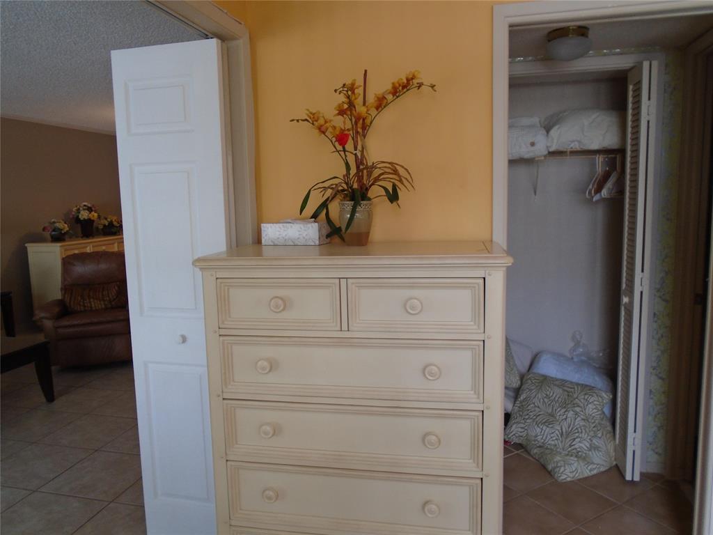 3165 Northeast 48th Court, Unit 110 Lighthouse Point, FL 33064 - Photo 14 of 49 a close view of a dresser