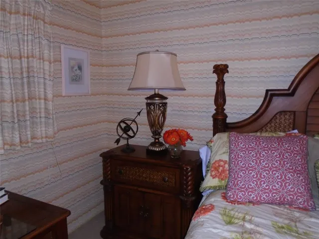 a room with a table and a lamp