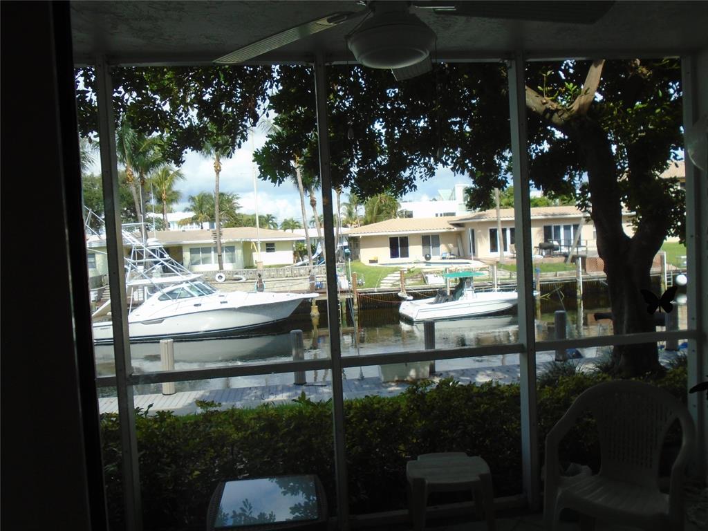 3165 Northeast 48th Court, Unit 110 Lighthouse Point, FL 33064 - Photo 2 of 49 a view of water fountain from a balcony