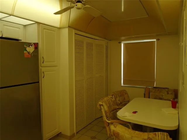 a kitchen with a stove and white cabinets